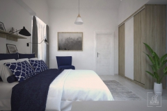 Wejście do pokoju - sypialnia w kolorach błękitu, niebieskiego bieli i odcieni drewna.